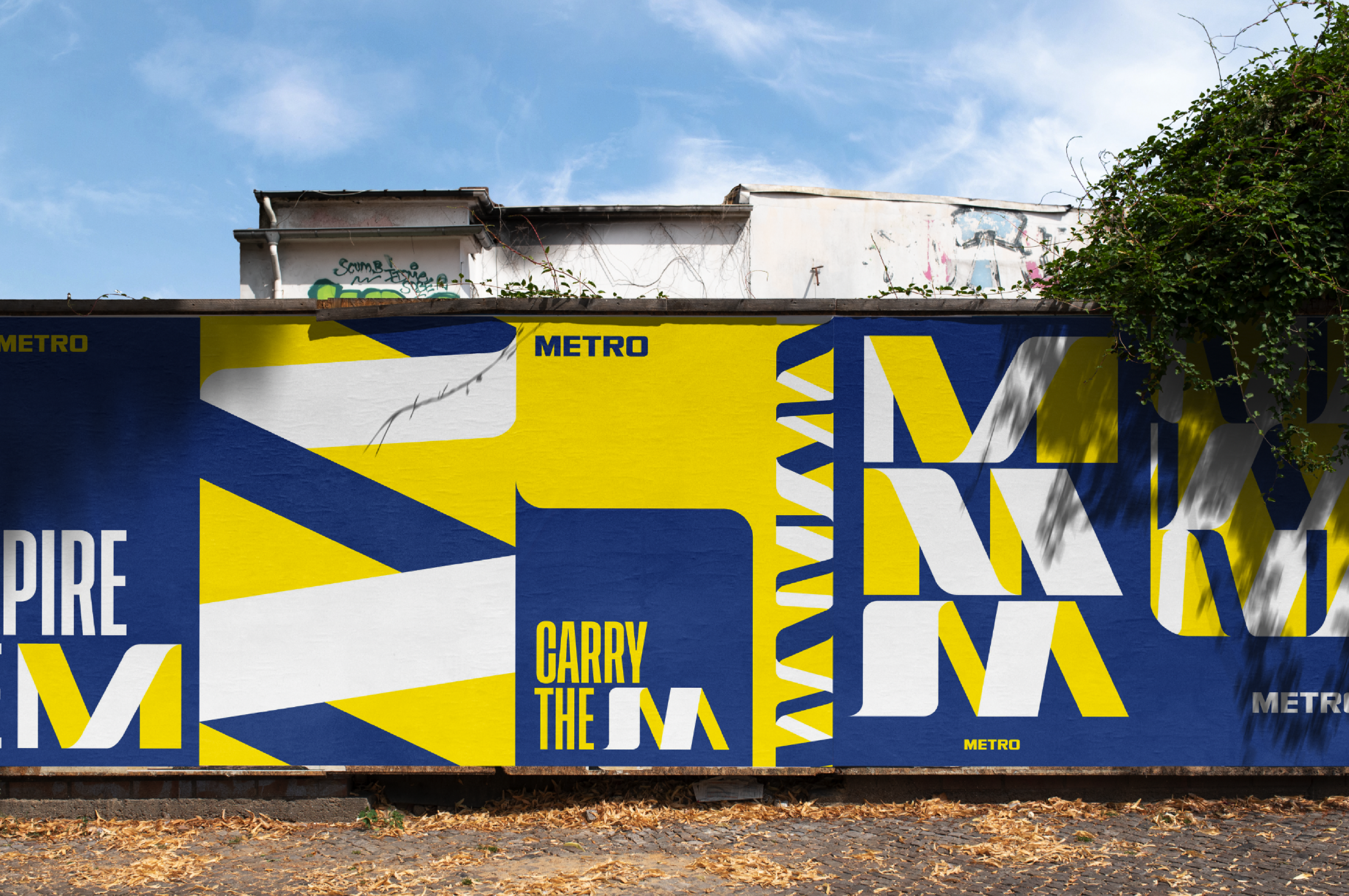 Poster wall with 'Carry the M'