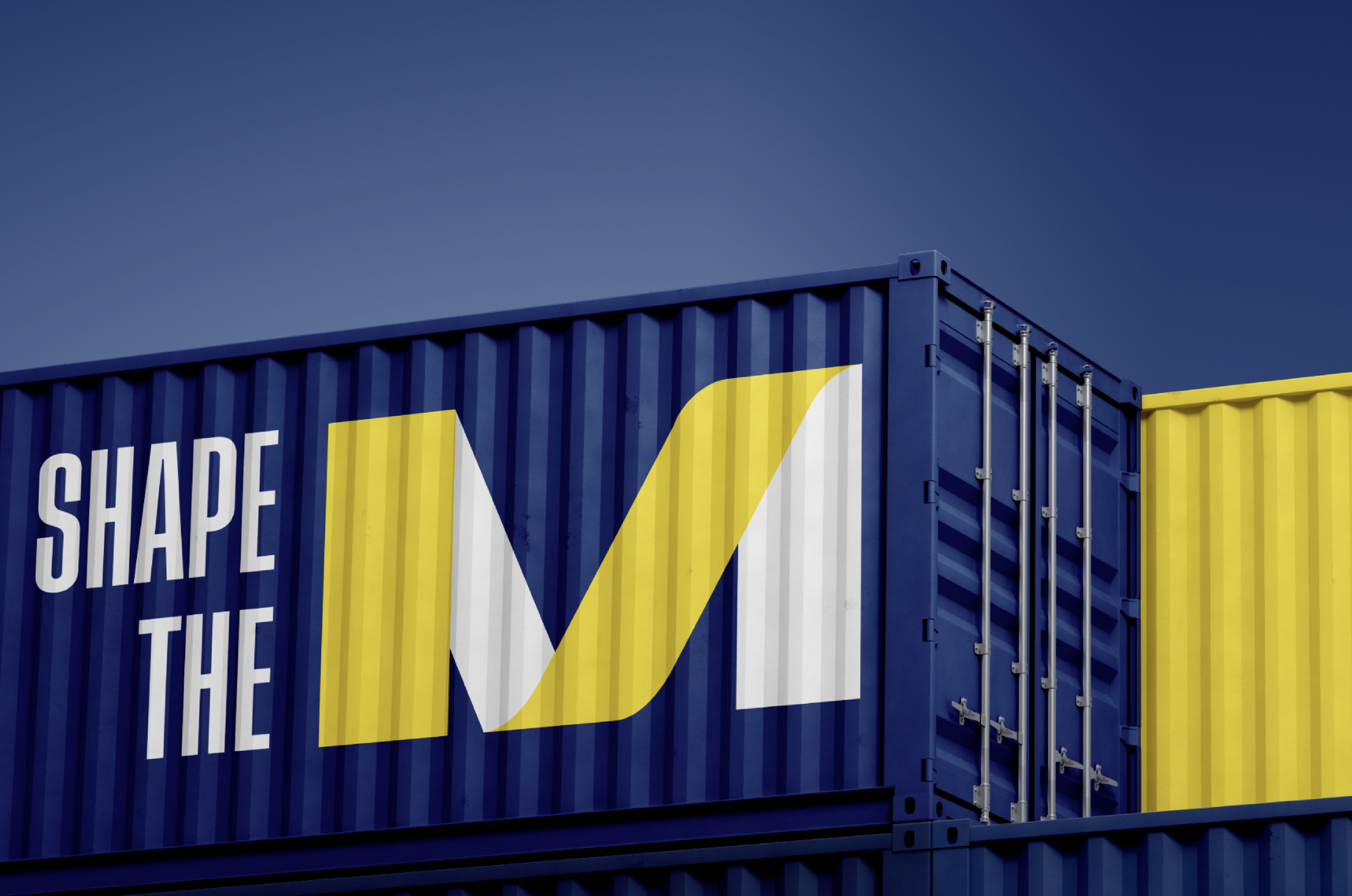 Container with 'Shape the M' text on it